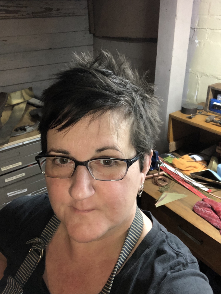 Karen, the artist behind KinkyBird Metals
