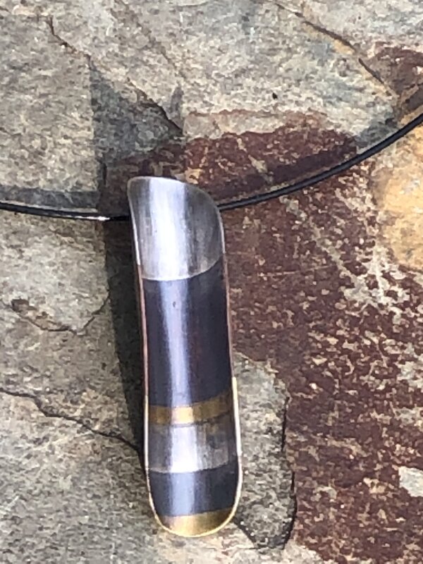 Handmade one of a kind striped metal pendant