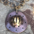 Sun detail on the copper pendant