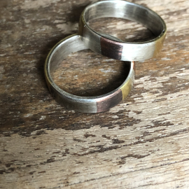 Marriage of metal 'Theirs" rings