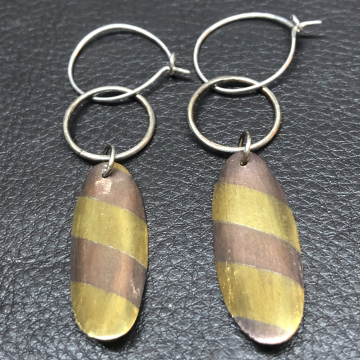SOLD Dangling by a hoop